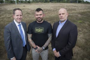 From left are Matt Holbrook, regional partner, St. John Properties, the parcel's developer; Danny Farrar, president and co-founder of Platoon 22 and Michael Meyer, president and CEO of Goodwill of Monocacy Valley, stand on the land that will become home to a 40,000 square foot building that will house Goodwill's headquarters and a Veterans Service center located on Monocacy Boulevard.