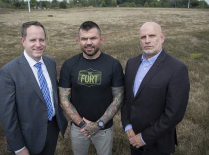 From left are Matt Holbrook, regional partner, St. John Properties, the parcel's developer; Danny Farrar, president and co-founder of Platoon 22 and Michael Meyer, president and CEO of Goodwill of Monocacy Valley, stand on the land that will become home to a 40,000 square foot building that will house Goodwill's headquarters and a Veterans Service center located on Monocacy Boulevard.