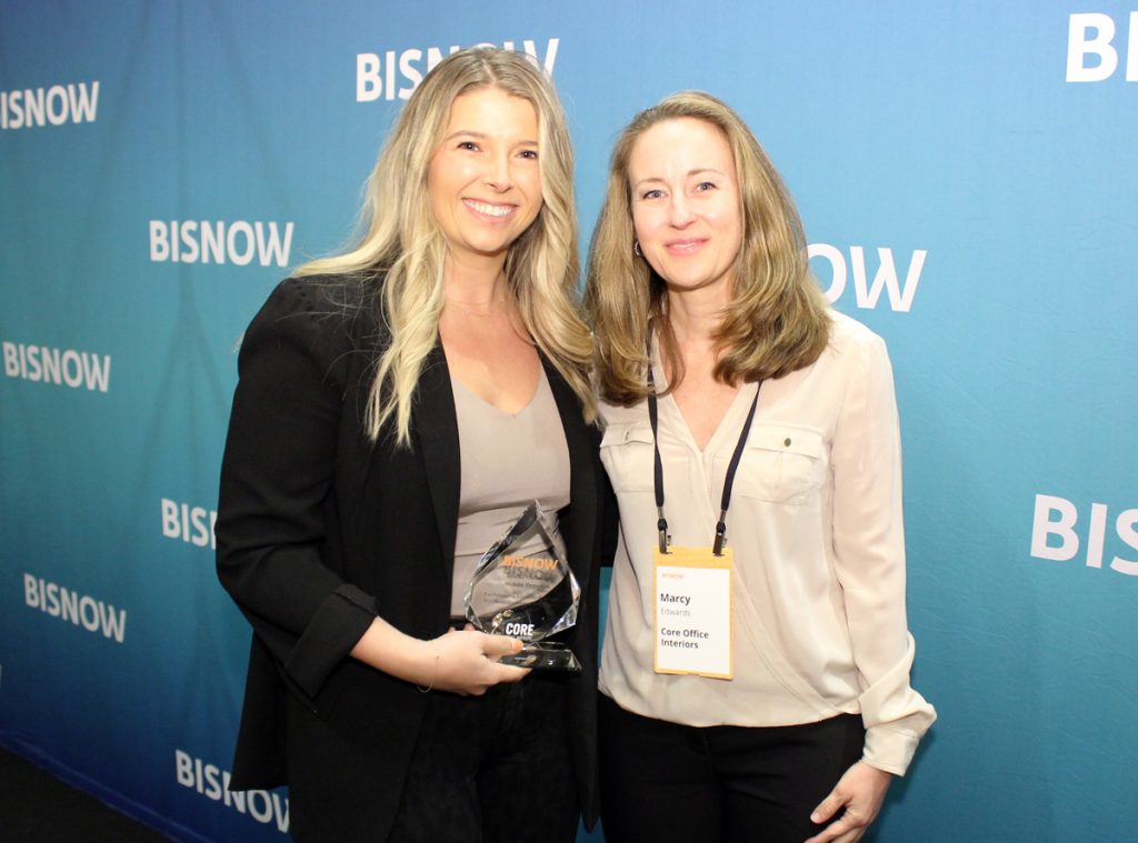 Brooke Harlander, regional partner for St. John Properties, accepts her Austin Women Leading Real Estate award from Core Office Interiors' Marcy Edwards.
