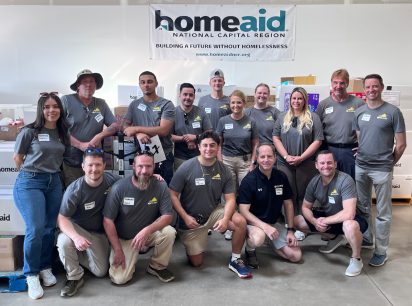 St. John Properties employees from the Virginia & Central Maryland regional office, alongside other volunteer groups, sorted and counted diapers and wipes at the Ashburn Crossing business community during HomeAid National Capital Region’s Diaper Drive.