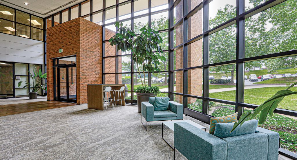 North Park office interior area with great glass lines and natural light, plush seating, and collaboration areas
